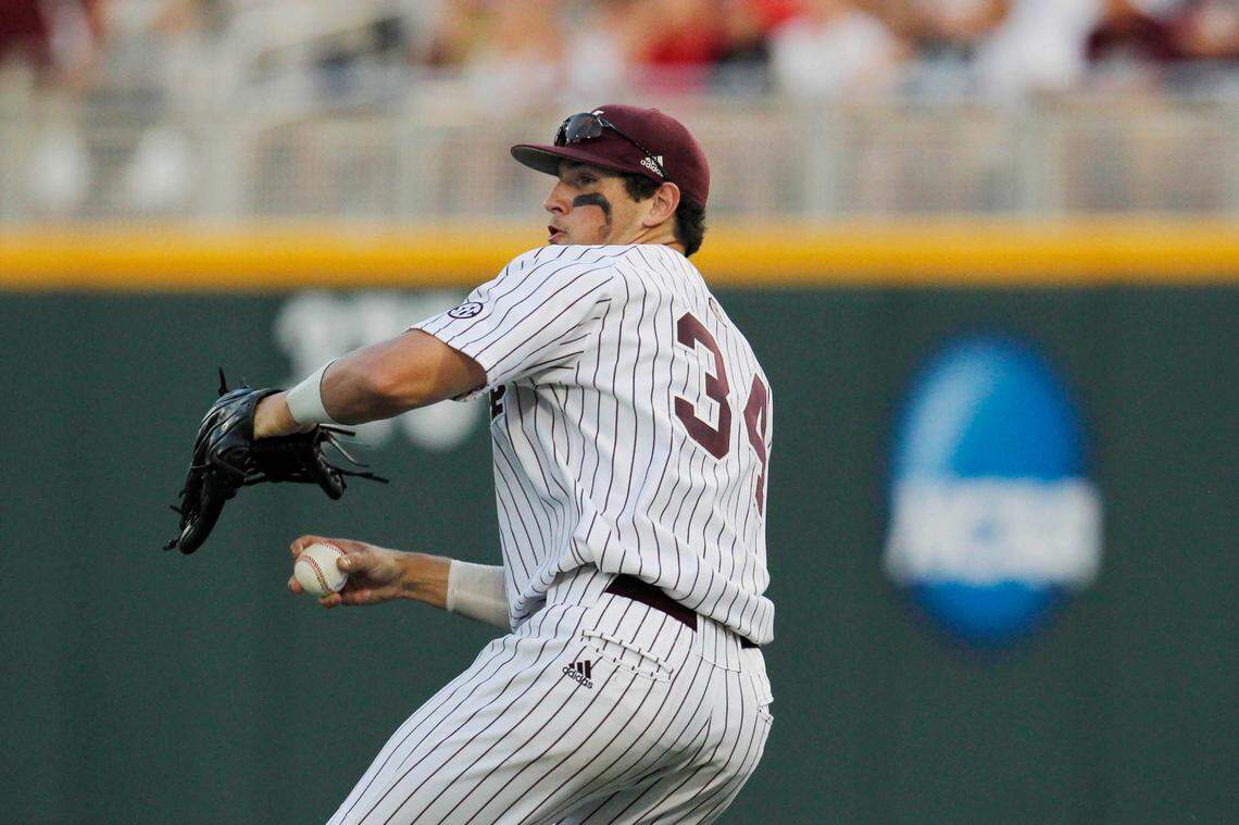 Mississippi State Bulldogs right fielder Hunter Renfroe (34) throws to first base to get UCLA Bruins right fielder Eric Filia out during Game 1 of the College World Series finals at TD Ameritrade Park on Jun 24, 2013 in Omaha, Nebraska.