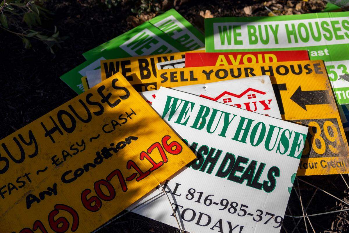 Erin Royals says businesses putting out signs offering to buy houses help convince homeowners that selling their home is the only option they have to get out of financial problems.