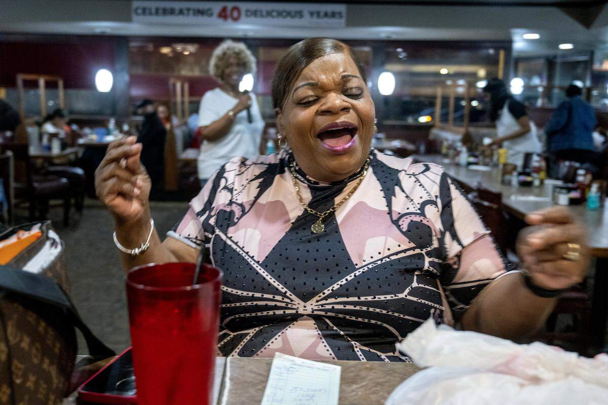 Dedree Carlisle of Kansas City sings along with owner Denise “Ms. Niecie” Ward during “Dinner & A Show” on Friday, Feb. 6, 2026, at Niecie's Restaurant in Kansas City. “I love First Fridays here at Niecie's,” said Carlisle. “It's a fun, laid-back atmosphere-family style.”