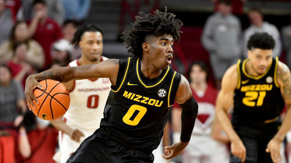 Missouri guard Anton Brookshire (0) runs a play against Arkansas during an NCAA college basketball game Wednesday, Jan. 12, 2022, in Fayetteville, Ark. (AP Photo/Michael Woods)