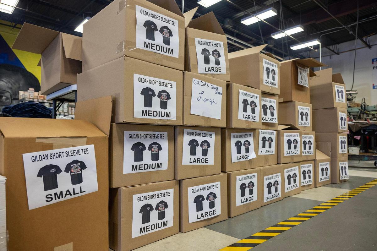 Boxes of memorial T-shirts honoring Kansas City Fire Department firefighter Graham Hoffman are seen at E2 Embroidery & Screenprinting on Tuesday, May 13, 2025, in Kansas City.