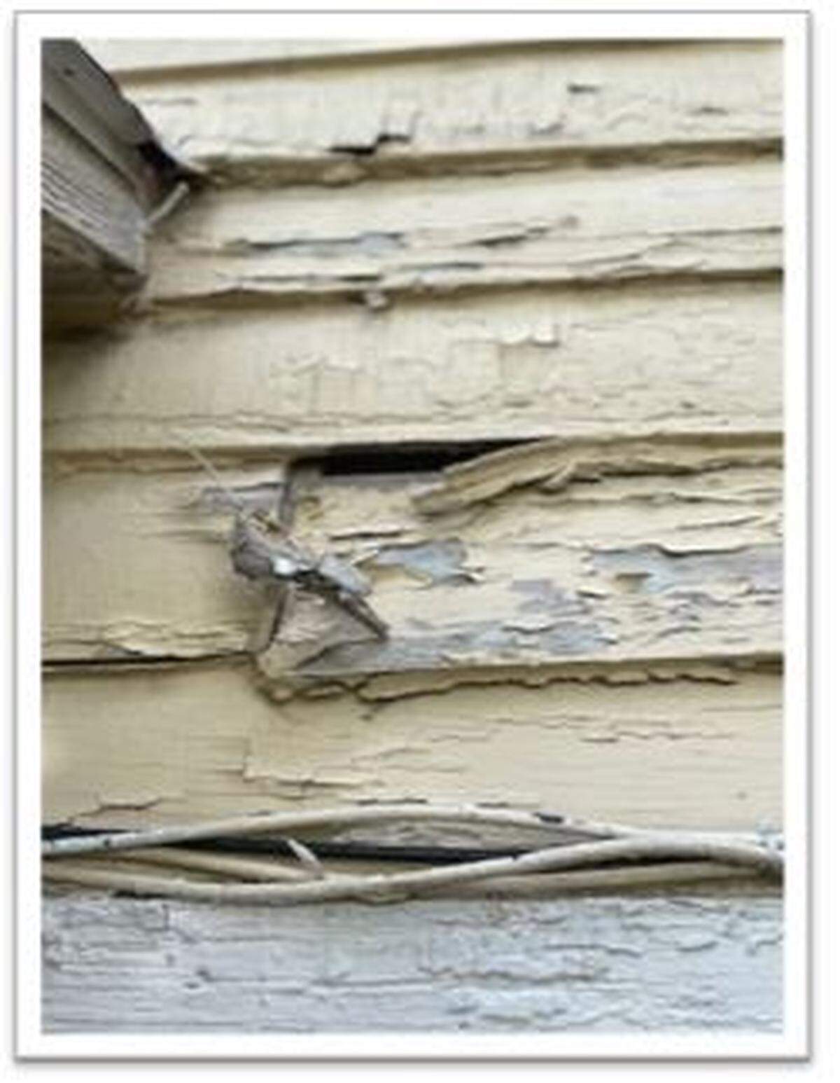 Damaged and unrepaired siding at the historic Syracuse House on Fort Leavenworth.