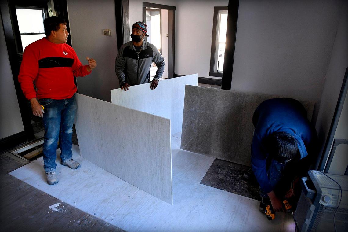 Bryan Murrell, middle, grew up in the Washington-Wheatley Neighborhood, and has become an active home renovator in the neighborhood. He and about eight other local builders have rehabbed more than 100 houses in surrounding neighborhoods.