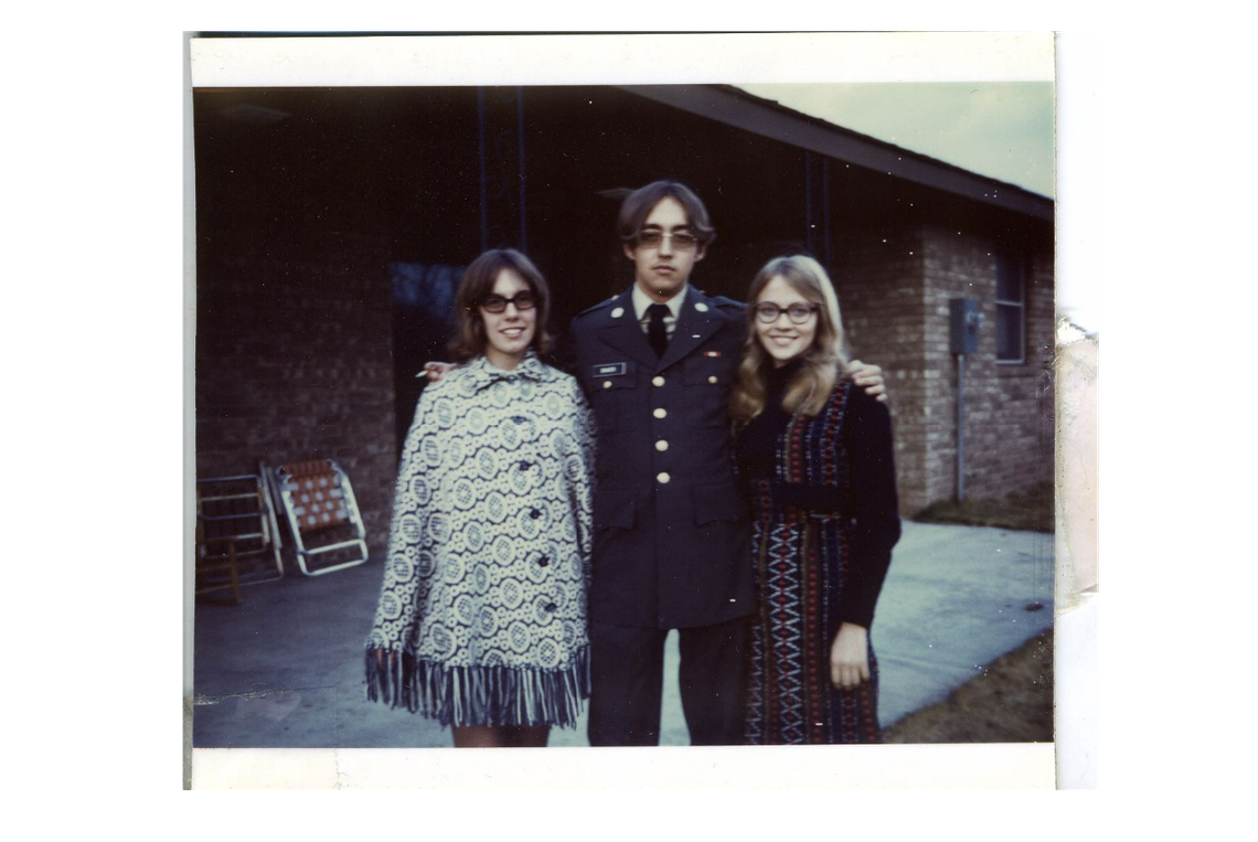 Gay artist and activist Gilbert Baker, a native of southeastern Kansas, is seen in his Army uniform in 1970, likely with his mother and sister.
