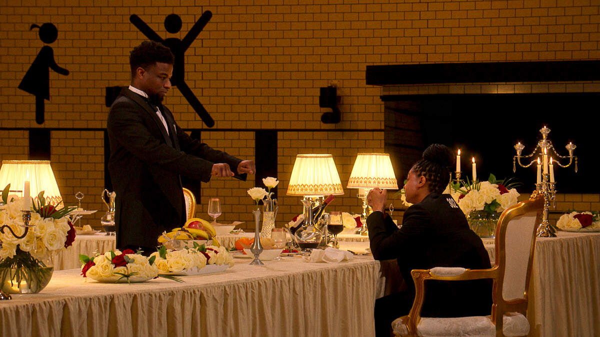 Trinity Parriman looks on at Dajah Graham during a scene in which he eliminated himself from Squid Game: The Challenge.