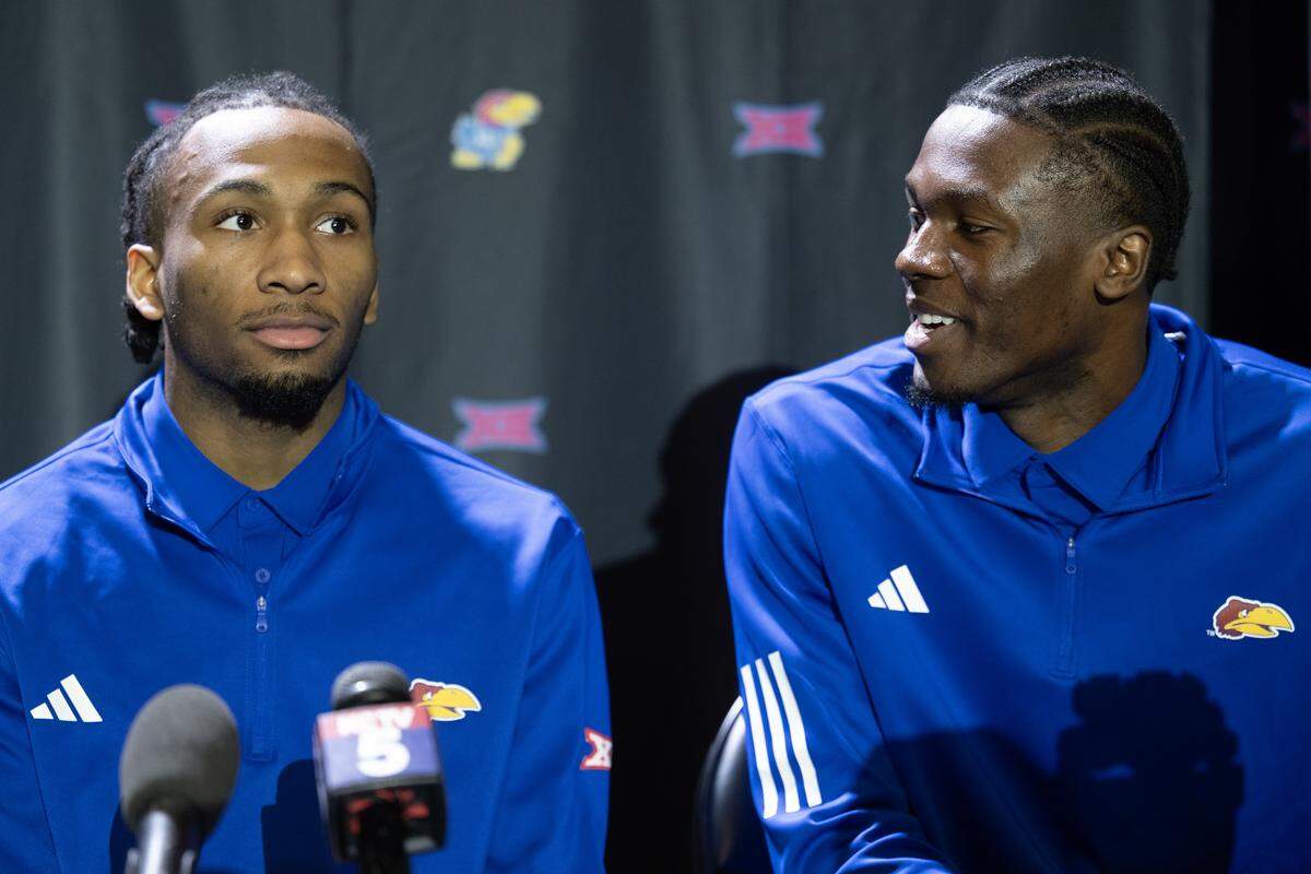 Kansas basketball players Darryn Peterson, left, and Flory Bidunga answer questions during Big 12 Basketball Media Day at T-Mobile Center on Wednesday, October 22, 2025, in Kansas City.