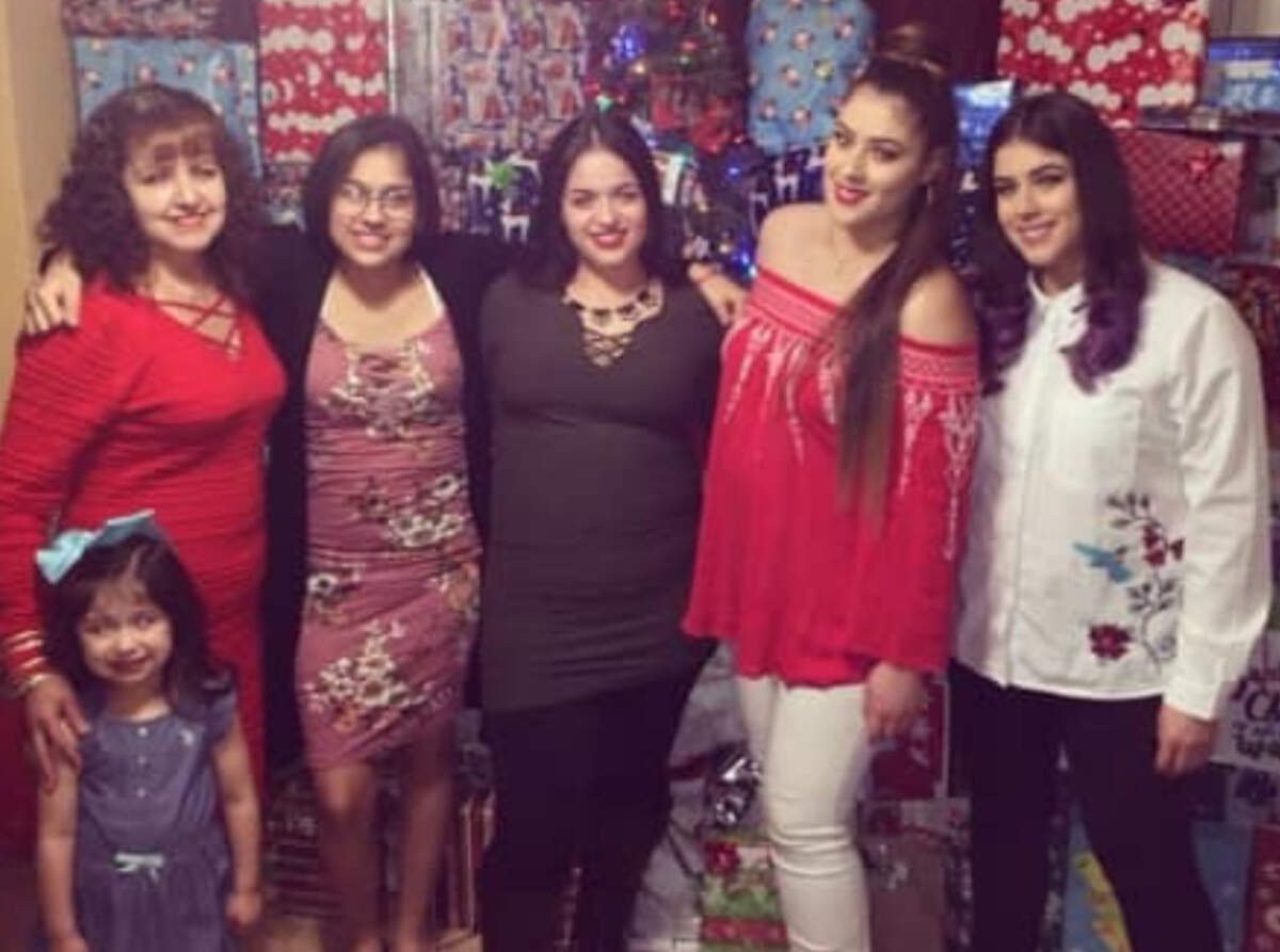 Octavia Barker, top left, poses with her four daughters, left to right, Arely Silva, Darcy Silva, Leslie Silva and Lilly Silva, and granddaughter Aleah Silva. Barker was killed Dec. 29 when her car was hit by a car speeding from police in Kansas City, Kan., at South 10th Street and Kansas Avenue.
