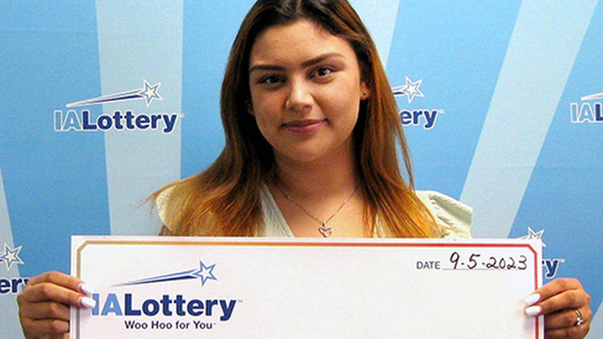Alexandra Perez-Gonzalez with her oversized check.