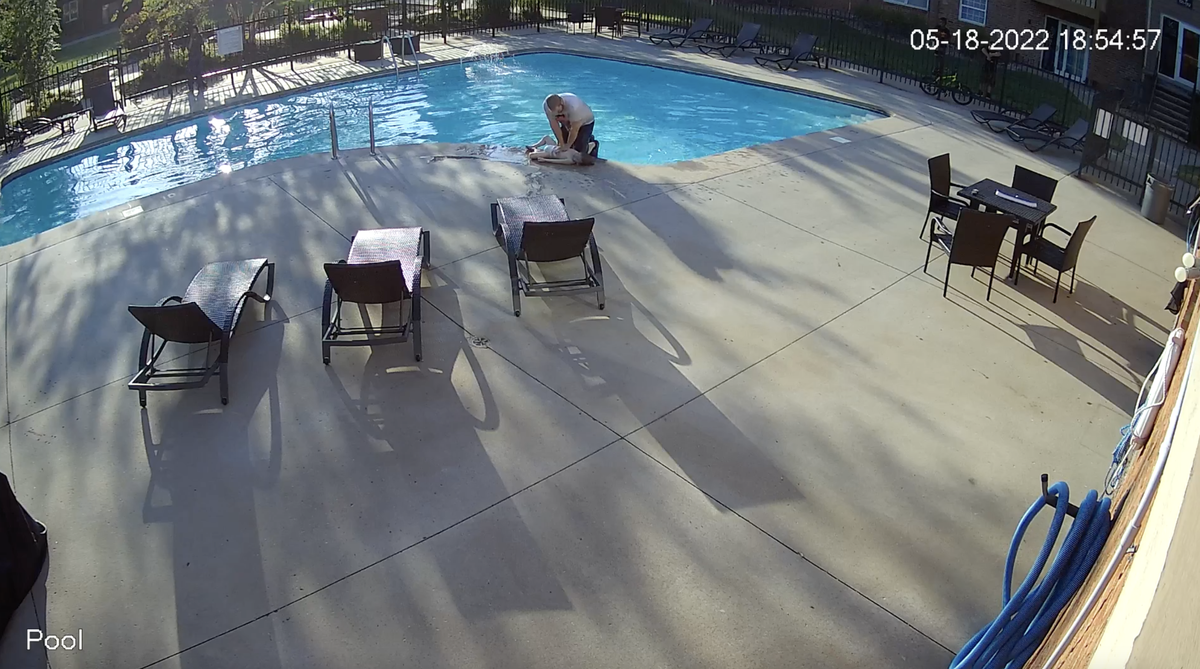 A Lawrence man administers life-saving aid to a 4-year-old who was drowning in his apartment complex pool on May 18.