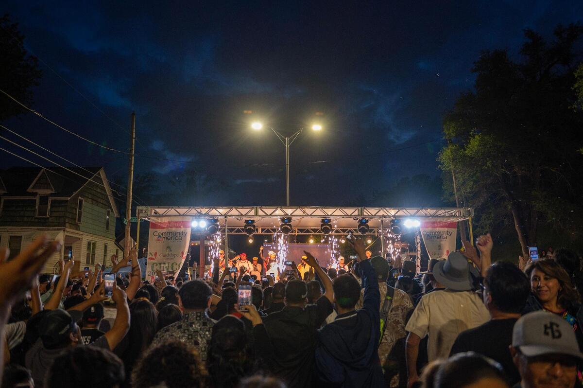 People gather to watch Chicos de Barrio perform during the Cinco de Mayo celebration at Guadalupe Centers on Friday, May 5, 2023, in Kansas City.