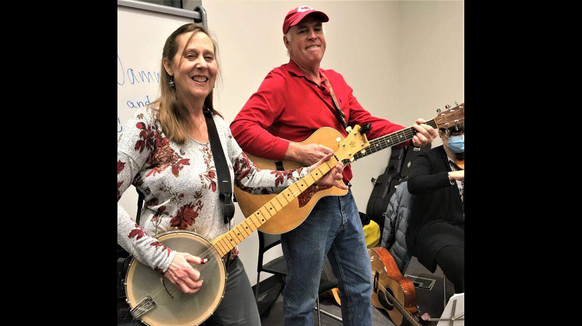 Mary and Kevin Corbett of Leawood volunteer to lead singing and play instruments every month at the Alzheimer’s Association Jam at the Johnson County Central Resource Library in Overland Park.
