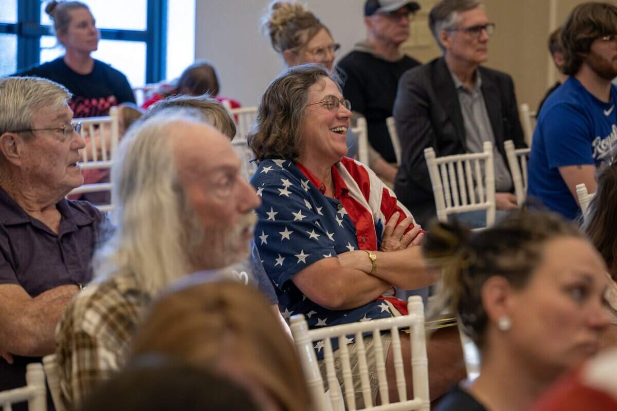 A community member reacts during a presentation at a town hall meeting at The Rhapsody on Tuesday, June 2, 2026, in Independence. The meeting focused on opposition to the proposed Nebius data center project.