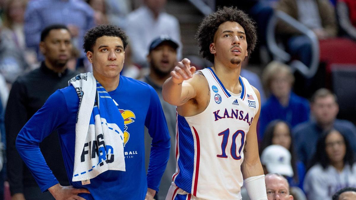 Kansas guard Kevin McCullar Jr. (15) and forward Jalen Wilson (10) watch from the bench during a first-round college basketball game against Howard in the NCAA Tournament Thursday, March 16, 2023, in Des Moines, Iowa.