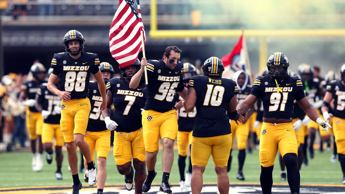 Sterling Webb #10 of the Missouri Tigers leads the team onto the field prior to the game against the Alabama Crimson Tide at Faurot Field at Memorial Stadium on October 11, 2025 in Columbia.