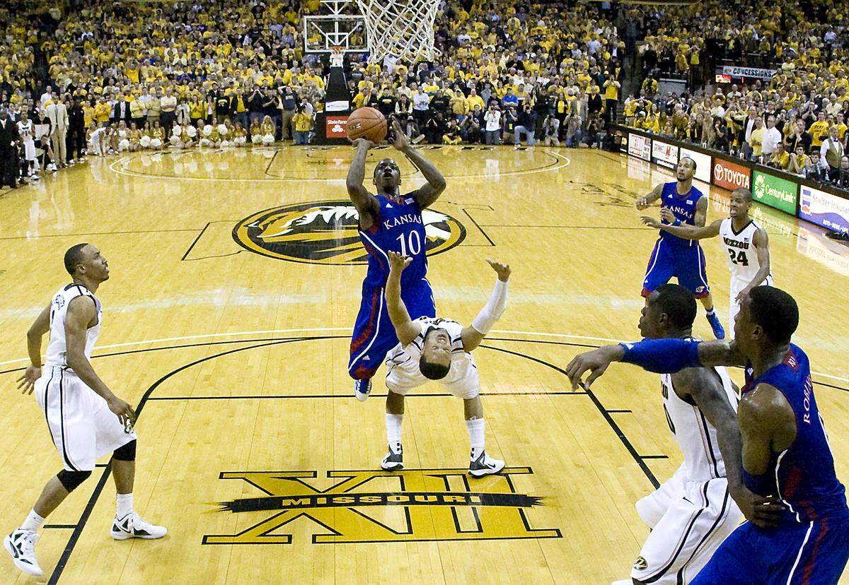 MU’s Michael Dixon took the charge delivered by KU’s Tyshawn Taylor in the closing minute and the Tigers were on their way to a 74-71 win on Feb. 4, 2012 at Mizzou Arena in Columbia.