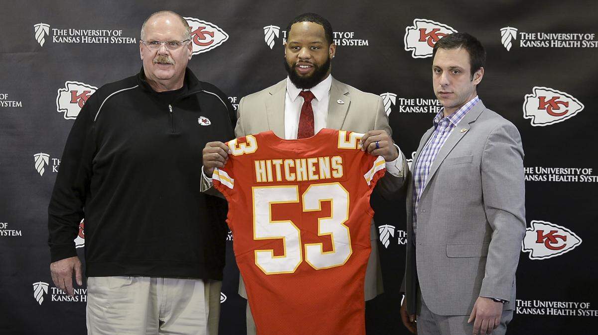 Newly signed Chiefs linebacker Anthony Hitchens, center, with coach Andy Reid and general manager Brett Veach, is part of a major rebuilding project on the defensive side of the football.