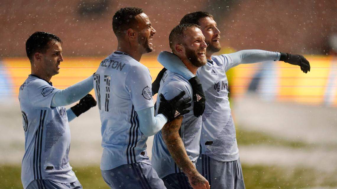 Sporting Kansas City’s Johnny Russell, second from the right, celebrates with teammates after scoring against Real Salt Lake in the first half Sunday in Sandy, Utah.