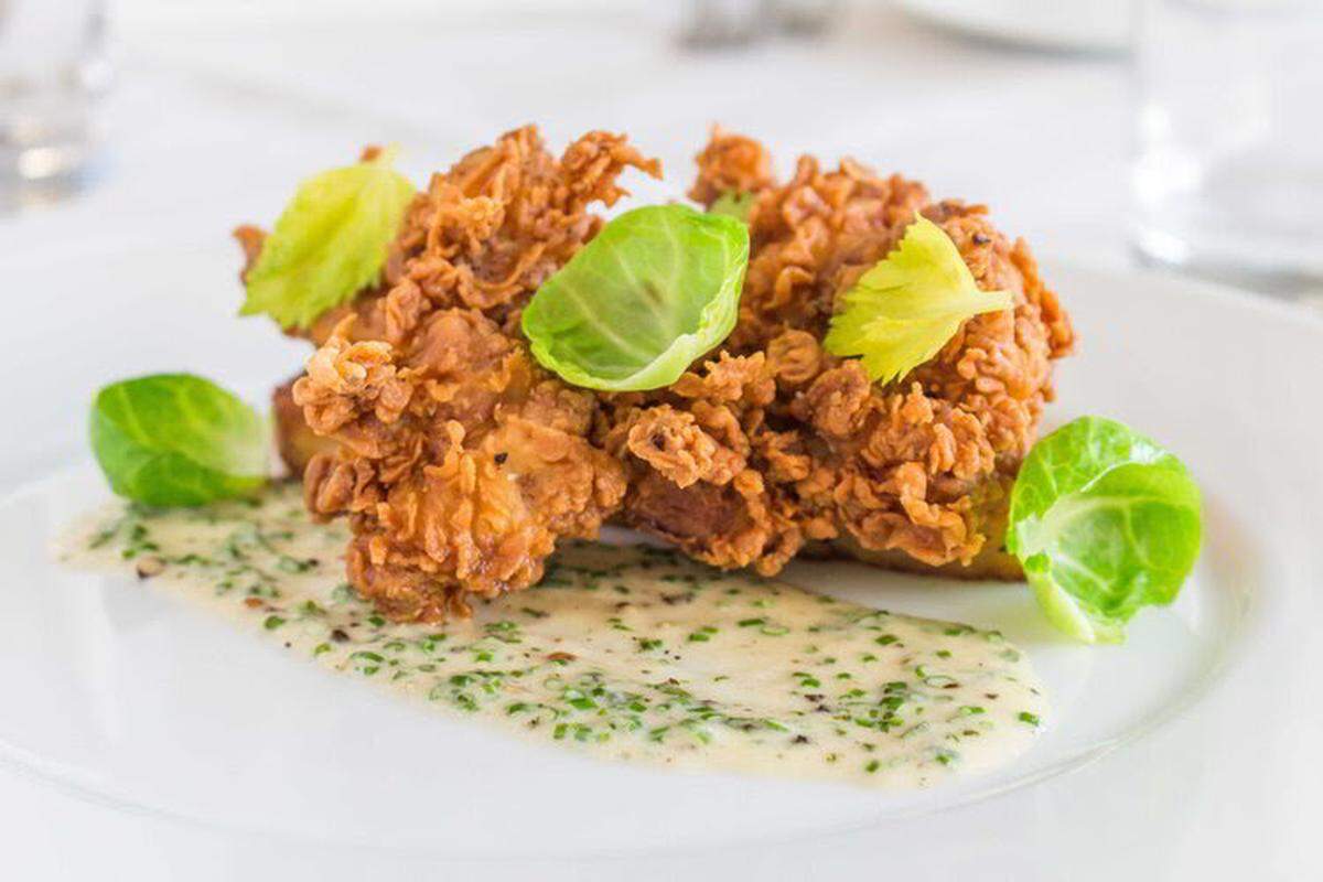 Story restaurant’s Campo Lindo Farms fried chicken special on Wednesdays is served with green beans, bread pudding and Parmesan gravy.&nbsp;