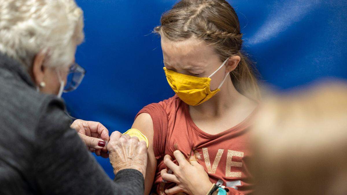 Evie Edwards, 9, receives her first dose of the COVID-19 vaccine at Children’s Mercy Hospital Kansas in Overland Park on Nov. 6.