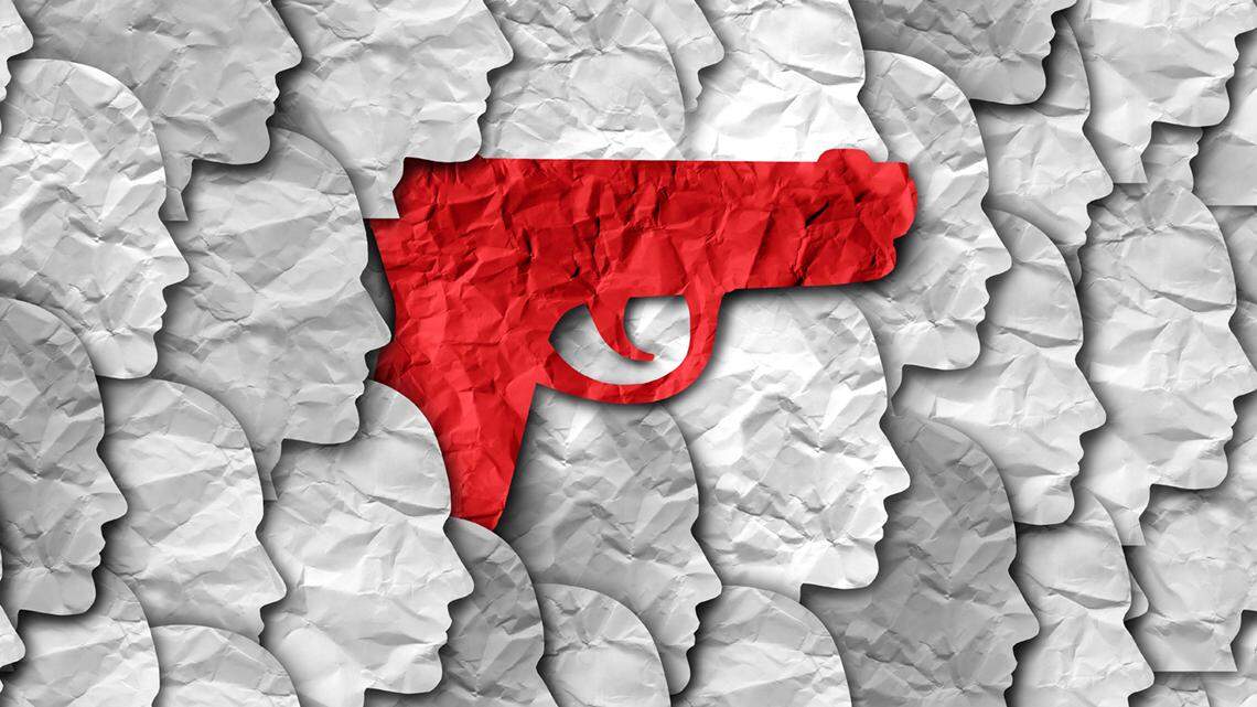 Gun violence and firearms in society concept as a gun among a community of people representing prevention of violent crime with guns or firearm legislation and mass shooting safety laws