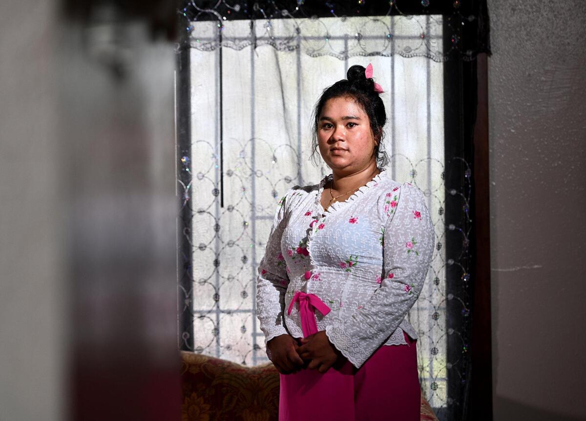 Shana Be in traditional Burmese clothing. As minority Muslims, Be’s parents fled persecution in Myanmar to a refugee camp in Thailand, where she didn’t receive an education and lived in poverty. Be dreamed of coming to the U.S and becoming a defense lawyer to help those who have been wronged. Instead, she has struggled to get by. A month ago, a fire displaced her family and she has had to start over.