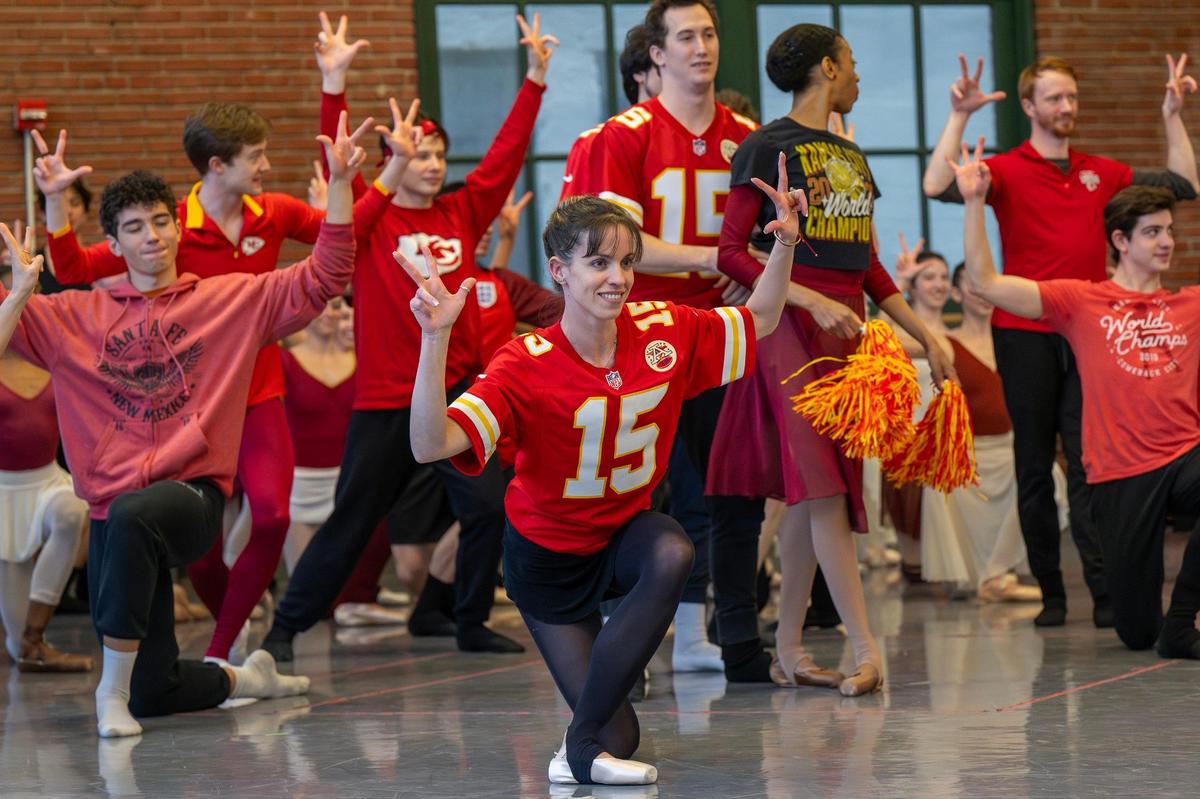 Ballet dancer Amaya Rodriguez, center, performs with her “teammates” in Chiefs attire during a rehearsal for the filming of the dance-off.