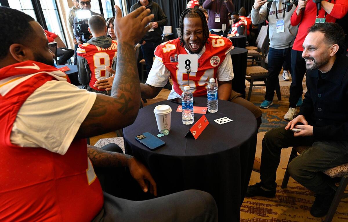 Kansas City Chiefs offensive tackle Donovan Smith, left, and Wanya Morris, offensive line, participated in a magic trick with Steven Frayne, better known by his former stage name Dynamo, during media availability at the team hotel in Henderson, Nev., on Thursday, Feb. 8, 2024..