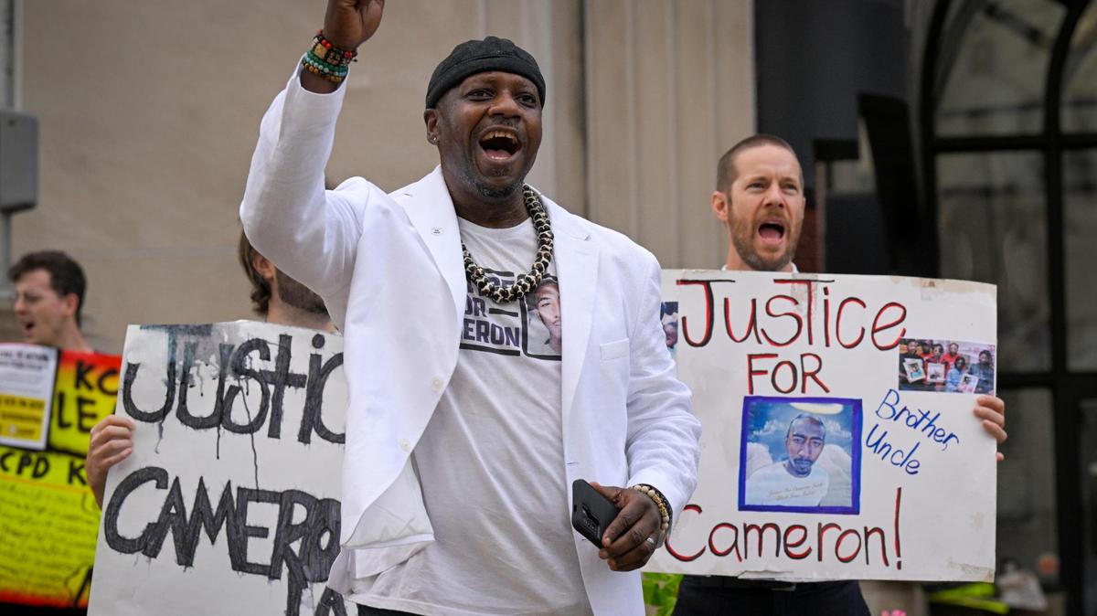 Steve Young of Kansas City Law Enforcement Accountability Project (KC LEAP) is suing KCPD because he was arrested after a commotion in a comedy club in 2022. Charges were dismissed in June. He is shown, center, at a 2023 rally protesting to uphold the conviction of Kansas City Police Det. Eric DeValkenaer.