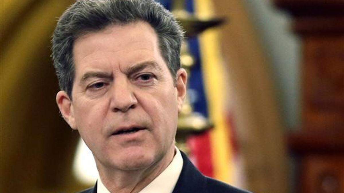 Then-Gov. Sam Brownback started KanCare, the state's privatized Medicaid program, in 2013.