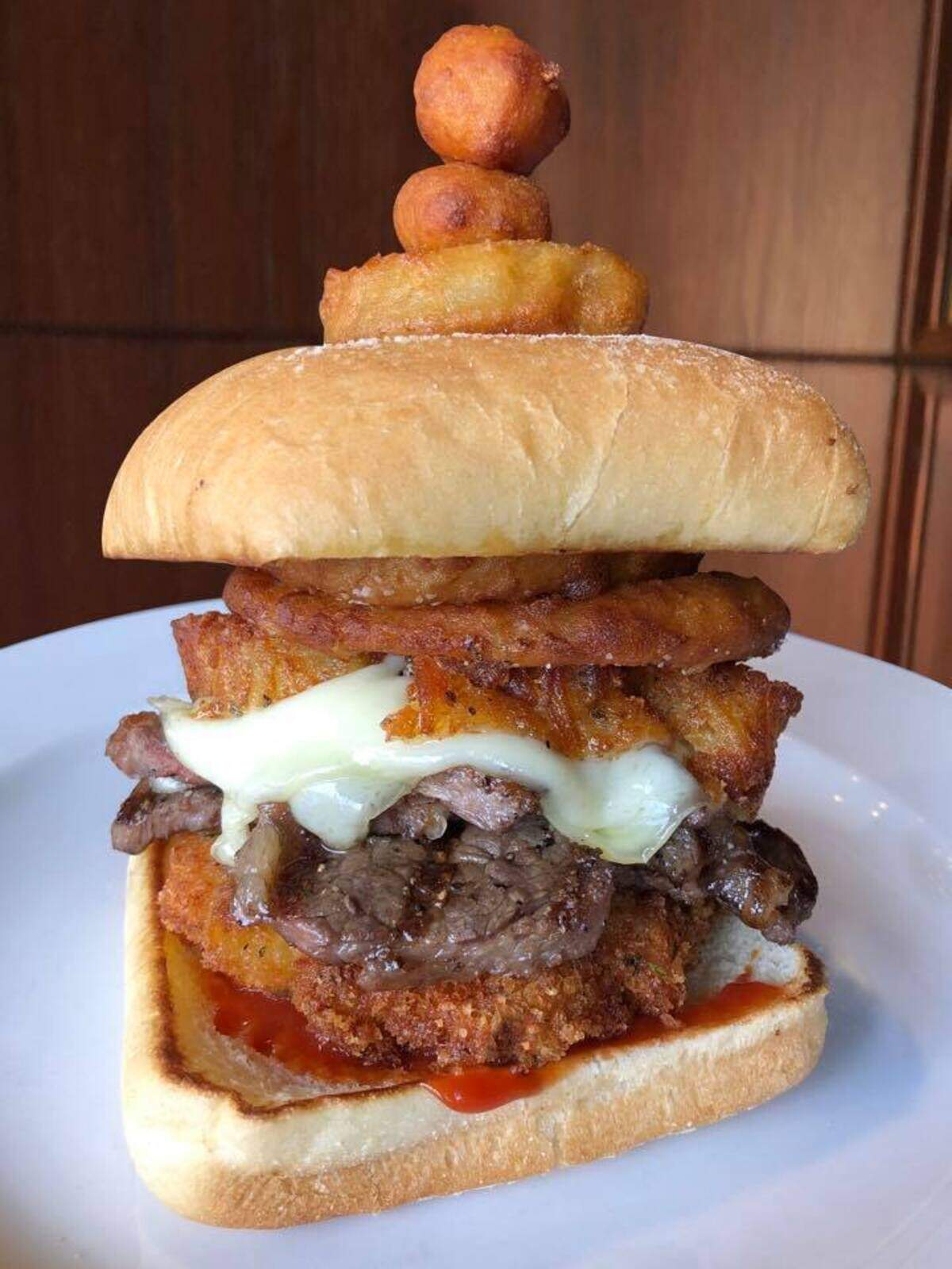 The Well is offering the Mahomes, a sandwich with some of the player’s favorite things — a tower of fried mac-and-cheese, grilled rib eye, and, of course, ketchup.