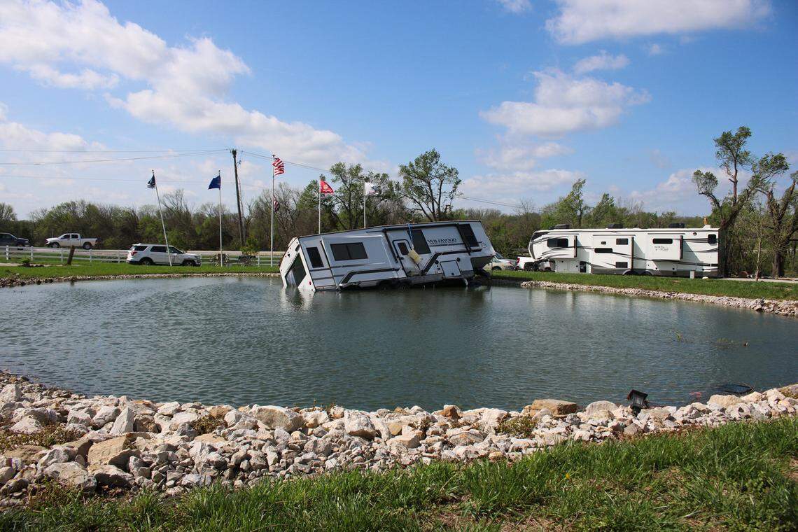 An RV is seen in a pond at the Shady Acres RV Park after a tornado caused widespread damage in the area on April 14, 2024.