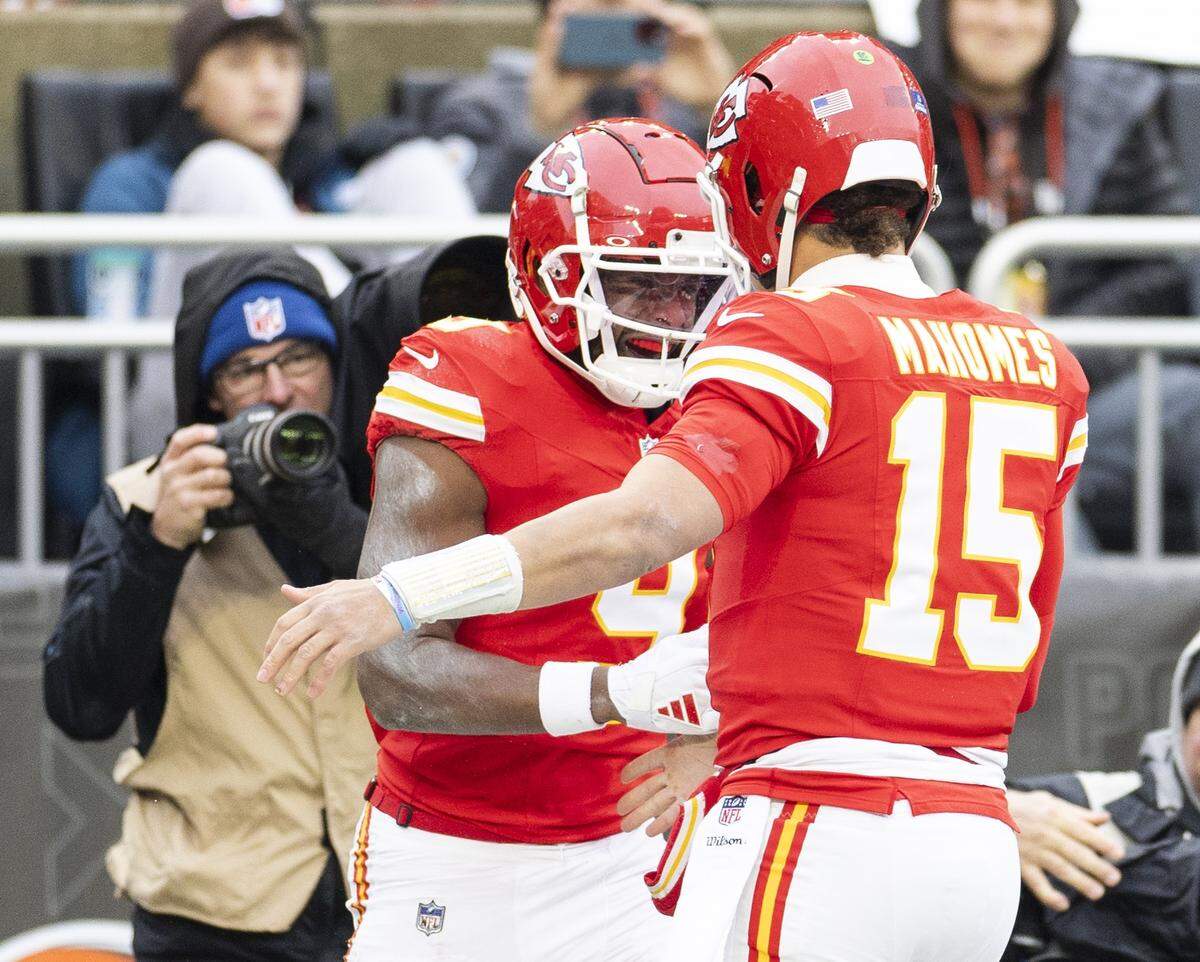 Kansas City Chiefs quarterback Patrick Mahomes (No. 15) congratulates wide receiver JuJu Smith-Schuster after their touchdown play against the Cleveland Browns during a Week 15 NFL game at Huntington Bank Field in Cleveland, Ohio on Sunday, Dec. 15, 2024.