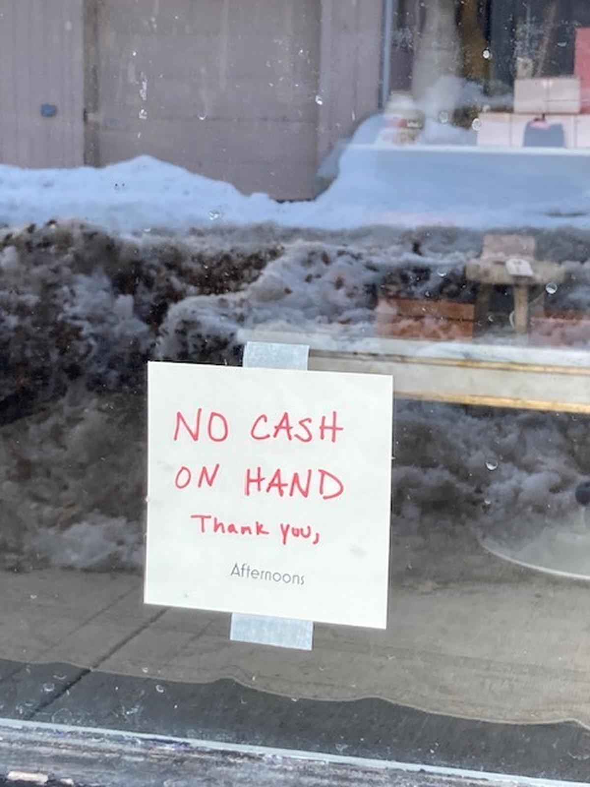 At Afternoons antiques and vintage goods on State Line Road, a handmade sign declares “No cash on hand.”