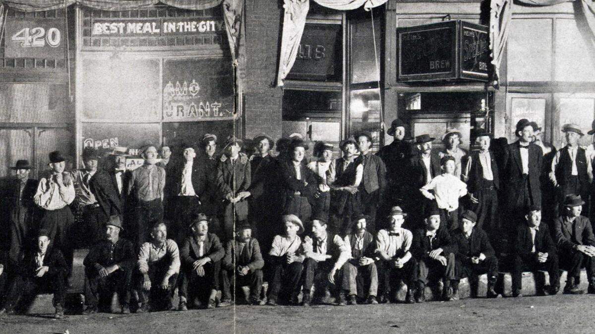 Unemployed men are photographed in downtown Kansas City in 1931.