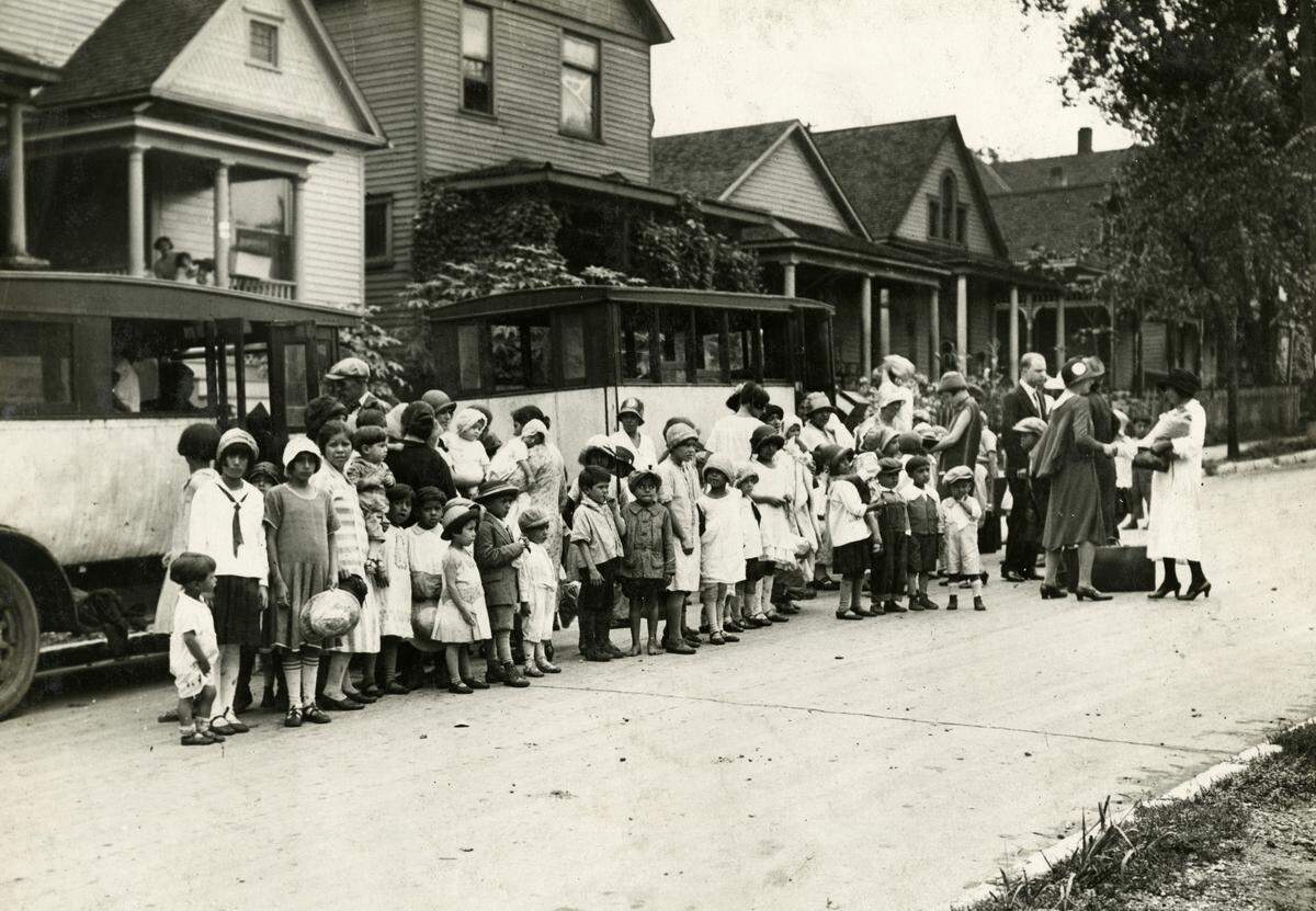 A group of Mexican American children from the Westside return from summer camp in 1926.