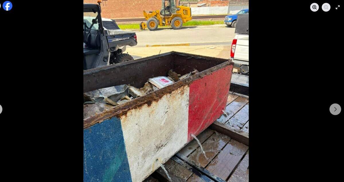 Water pours from a time capsule that was buried in 1976 in Pleasant Hill and was to have been opened and unveiled at a ceremony on July 4 as part of the United States’ 250th anniversary.