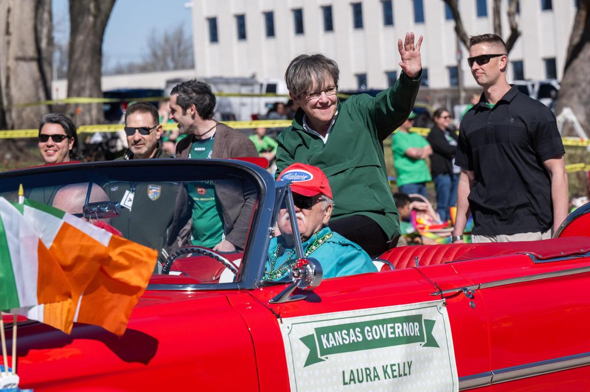 Kansas Gov. Laura Kelly waves to parade goers in the Kansas City St. Patrick’s Day Parade on Monday, March 17, 2025.