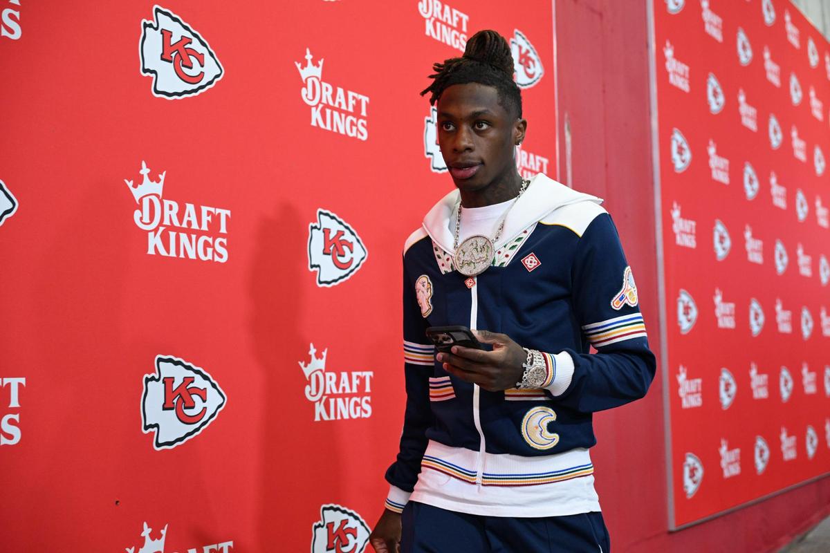 Wide receiver Xavier Worthy kept warm in an upscale varsity jacket by Casablanca.