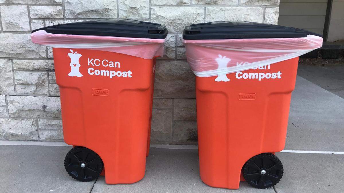 Two food waste dropoff bins are seen next to the Harrison Street entrance of the Kansas City Health Department at 2400 Troost Ave. on Monday, July 10, 2023. The bins are part of the city’s composting pilot program and are maintained by the local organization KC Can Compost.
