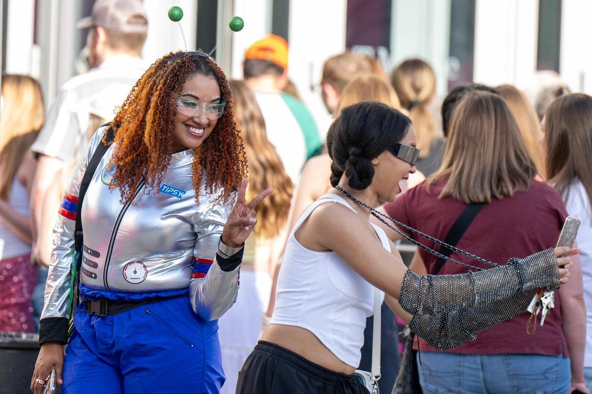 Fans take selfies while waiting in line for Katy Perry’s Lifetimes Tour at the T-Mobile Center on Saturday, May 10, 2025, in Kansas City.