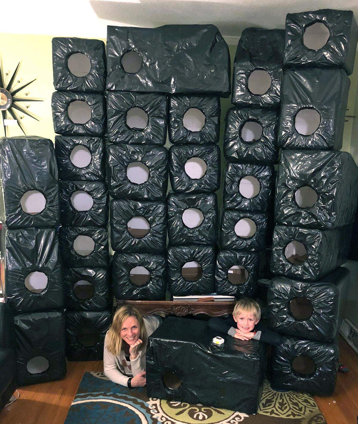 Stephanie Lindquist-Johnson and her son, Phillip Johnson of Roeland Park have been making shelters for feral cats out of foam coolers donated by people responding to a post she wrote on Nextdoor, a neighborhood social media site. The shelters have given back to people in the community who want to house outdoor cats, raccoons or opossums from the winter weather.