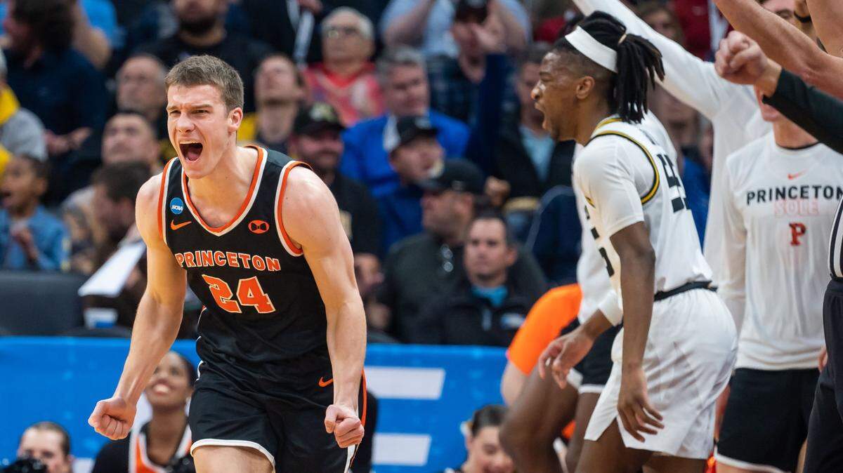 Princeton Tigers guard Blake Peters, left, yells out after sinking a three-pointer on Saturday against the Missouri Tigers during the second-round NCAA Tournament game at Golden 1 Center in Sacramento.