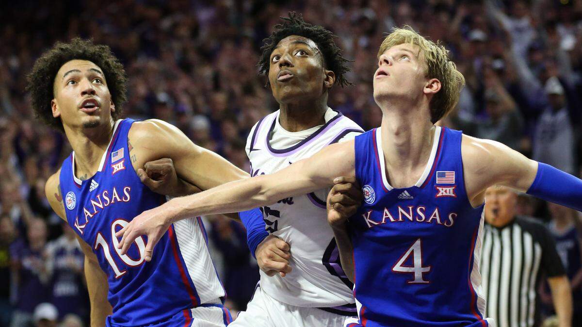 Kansas State forward David N’Guessan is blocked out by Kansas Jayhawks guard Gradey Dick (4) and forward Jalen Wilson (10) during the first half at Bramlage Coliseum on Jan. 17, 2023.
