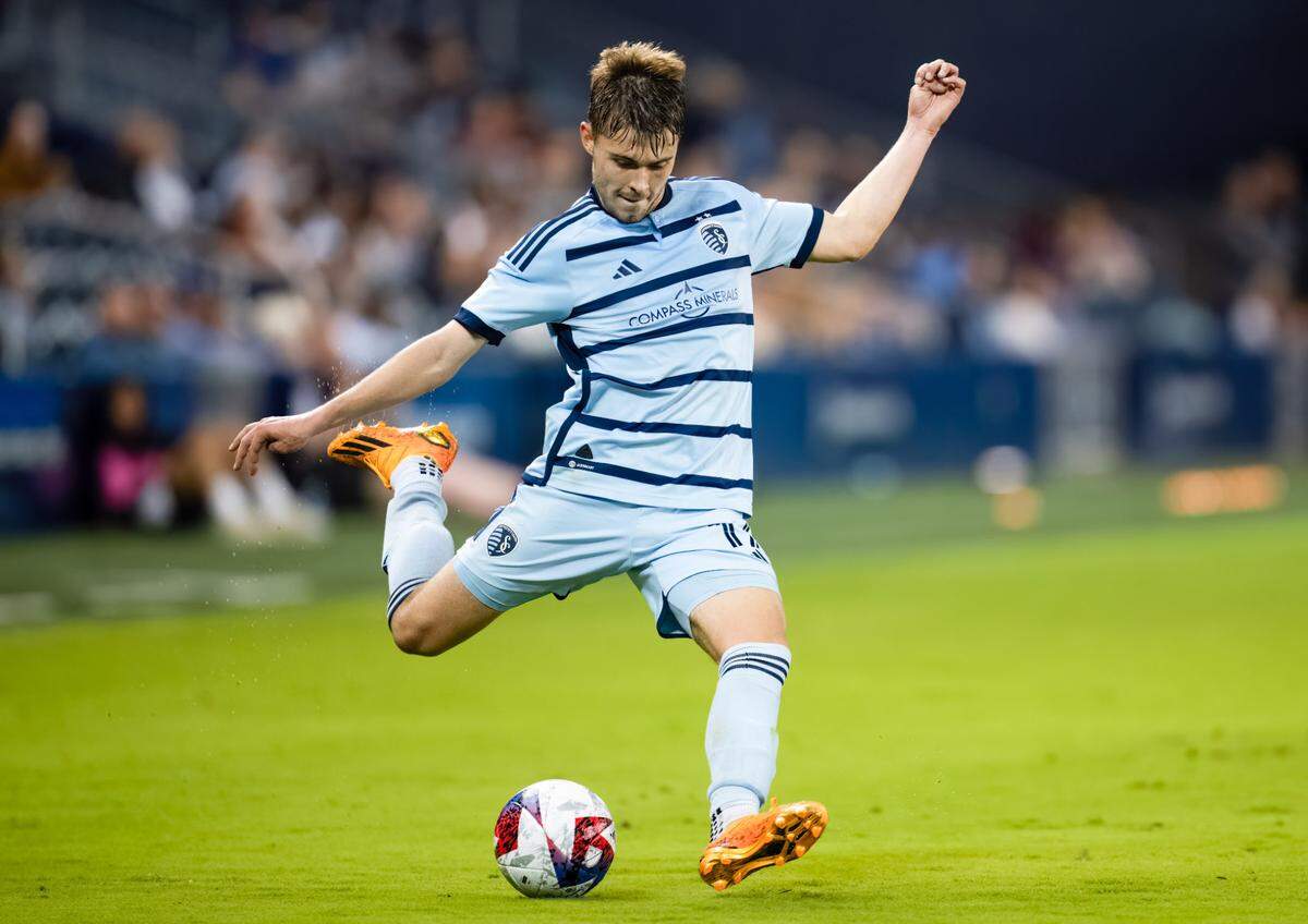 Sporting Kansas City midfielder Jake Davis (17) crosses the ball during the second half against Tulsa Athletic at Children’s Mercy Park on April 25, 2023.