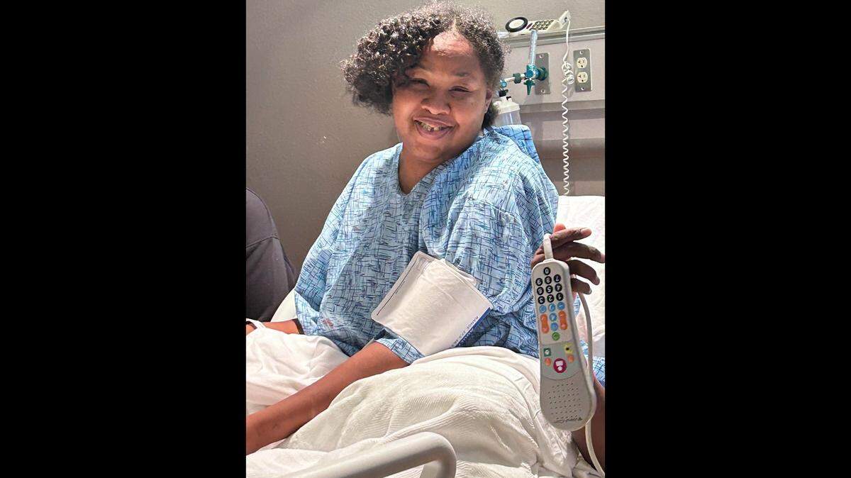 Regena Robinson was hospitalized after she collapsed at the women’s prison in Topeka. She and her mother are suing the Kansas Department of Corrections.