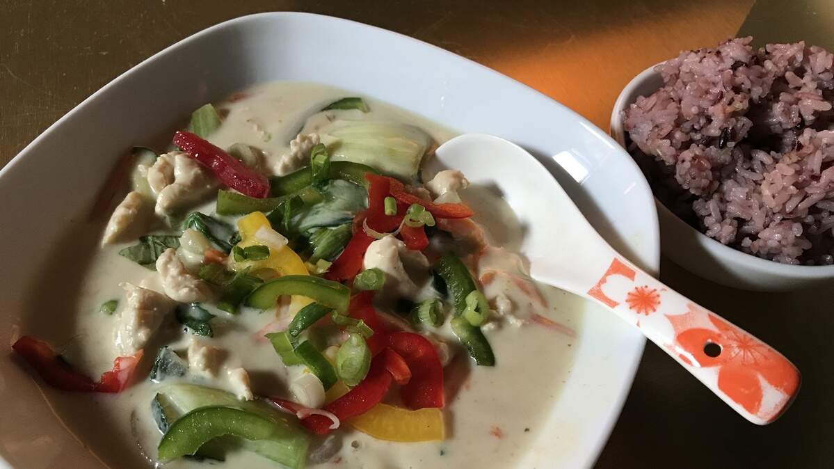 Kobi-Q's green curry is coconut-based with a choice of chicken or tofu and vegetables, along with a side of rice.