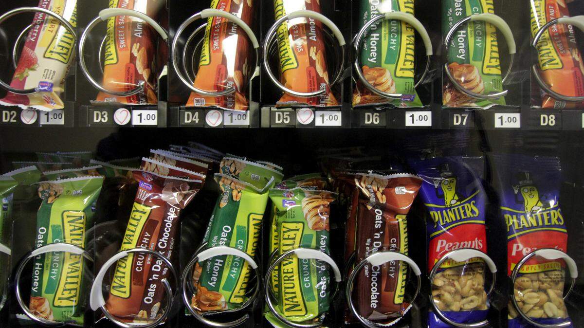 A new study from the Centers for Disease Control and Prevention finds that more than 20 percent of working Americans get food at least once a week at work - and much of it is unhealthy, high in fat and sugar. Researchers recommended workplaces provide more healthy snacks in vending machines, such as this.