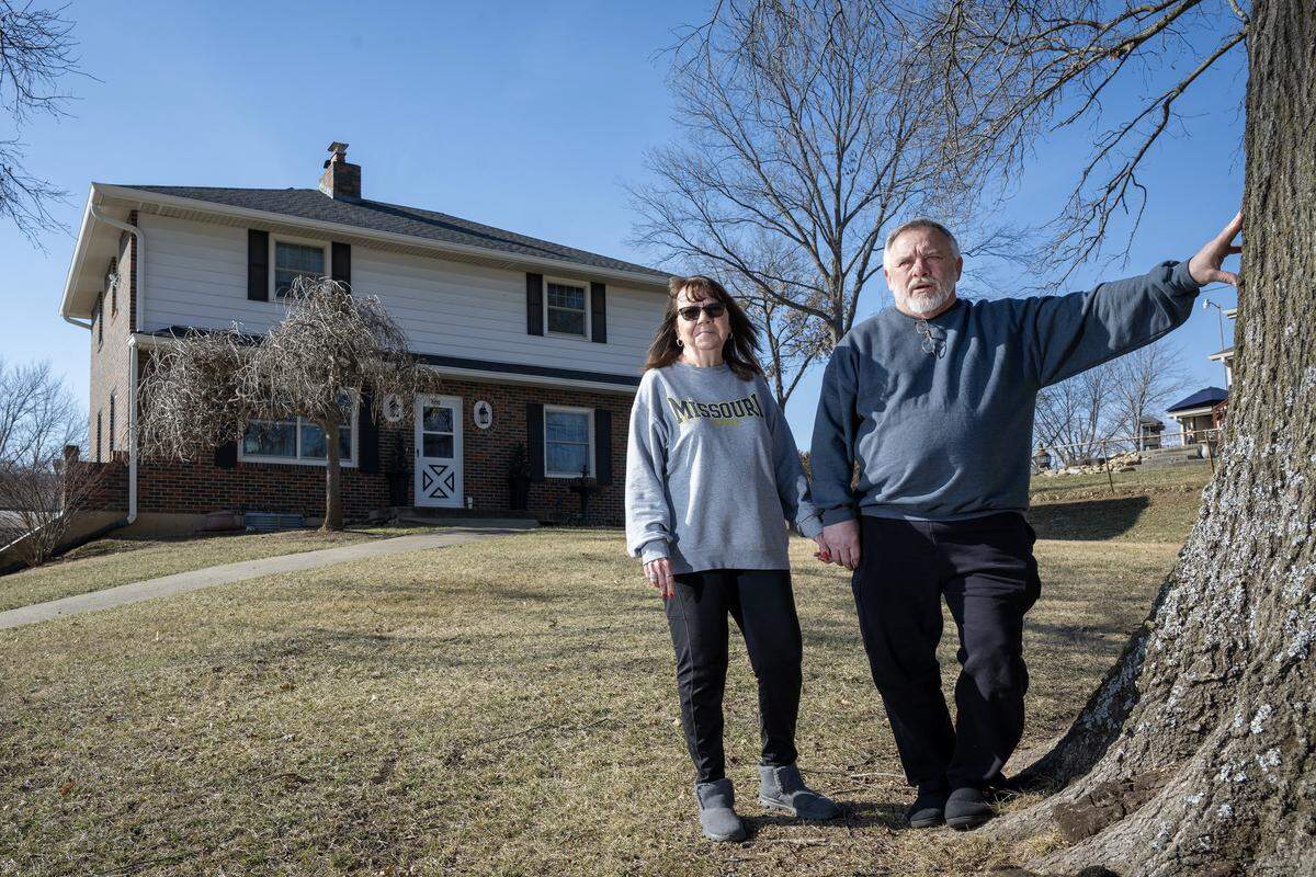 Mary and Howard Hoff stand outside their home on Bly Road in eastern Independence, which sits within close proximity to the site of a proposed 400-acre, $6.6 billion AI data center. The couple, adamantly opposed to the development, and can see and hear the project from their eight-acre property.