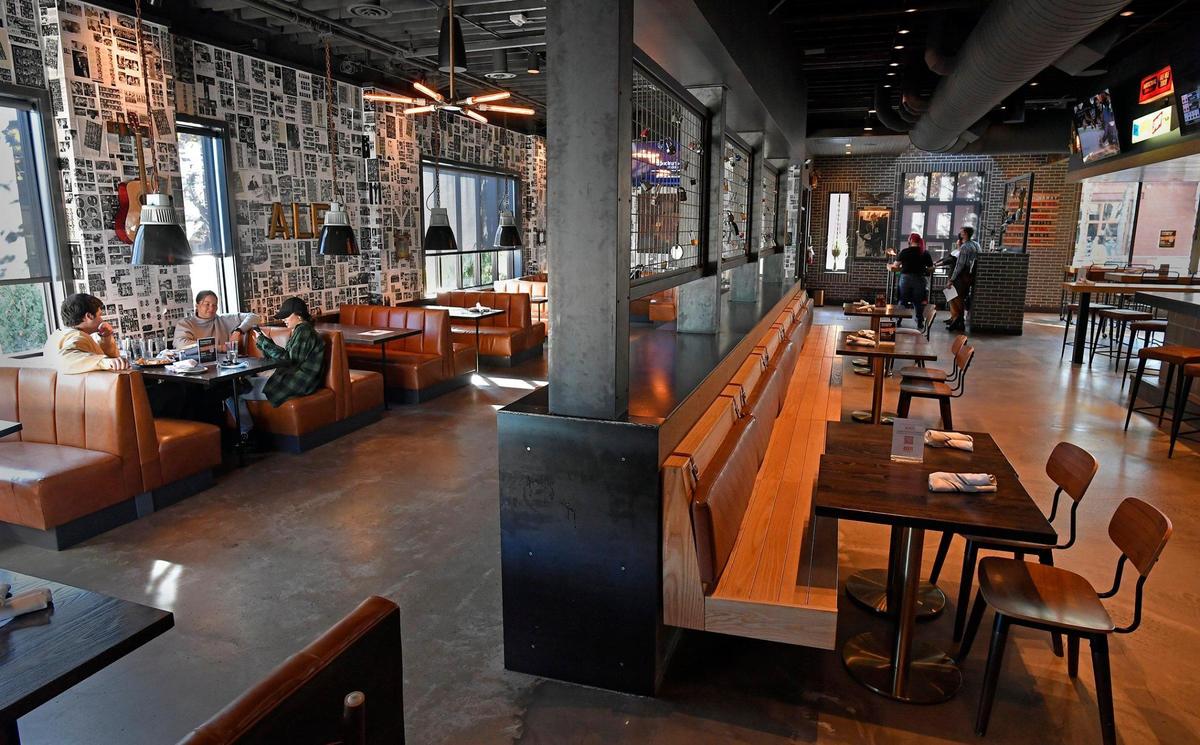 Bars and restaurants like Mickey’s Hideaway in Westport will be able to return to serving customers at something close to normal capacity starting Friday night. The rollback of some restrictions on the bars and restaurants was announced Friday by Mayor Quinton Lucas.