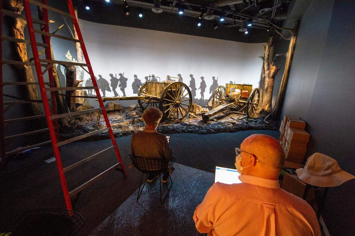 Two technicians work on the World War I Theater at the Harry S. Truman Presidential Library & Museum. The museum, which closed in July 2019 for renovation, will reopen early next year if all goes well in the pandemic.